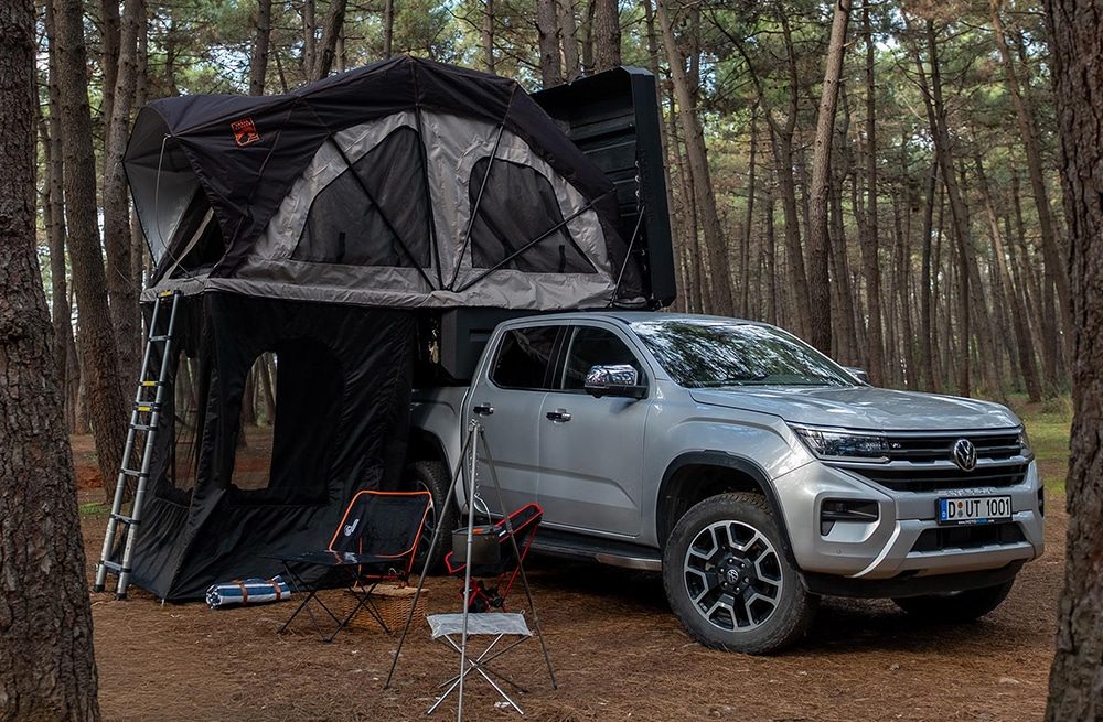 Atlas camper topper on a pickup in the forest